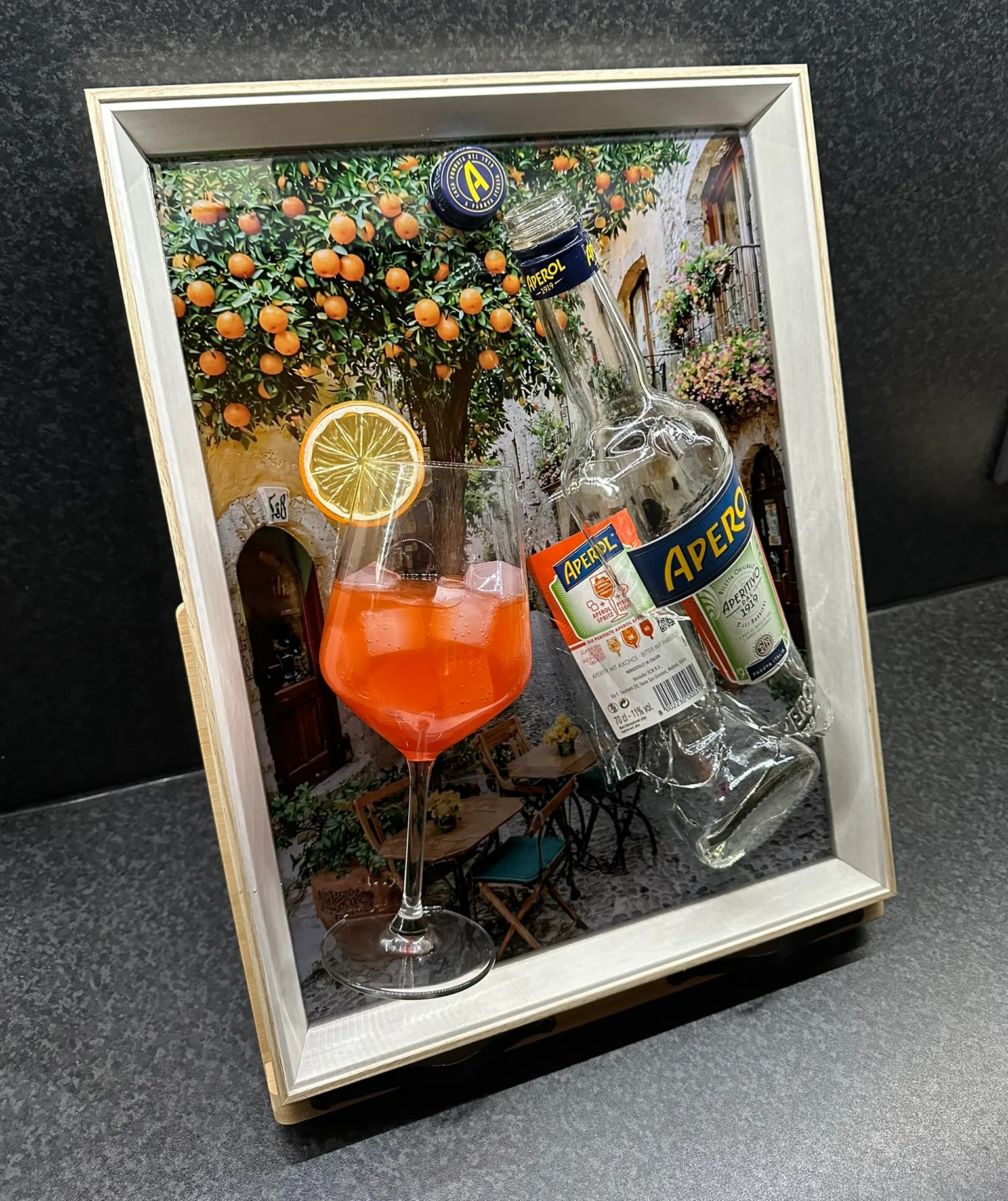 Aperol – Gebroken Fles met Glas
